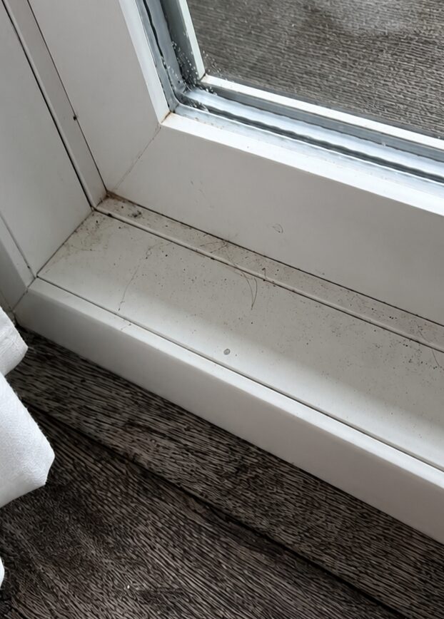 Window track before cleaning